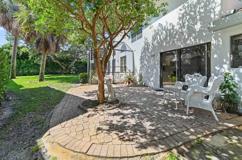 a view of a house with backyard porch and patio
