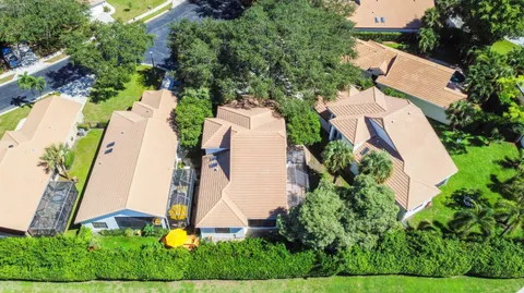an aerial view of residential house with outdoor space and swimming pool
