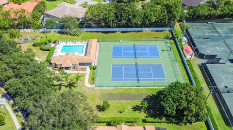 a view of swimming pool with a garden and outdoor seating