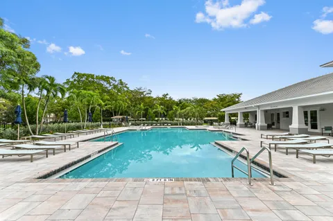 a view of a swimming pool with lounge chair