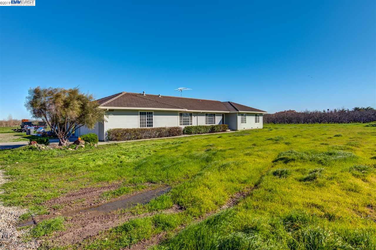 5801 Durham Ferry Road Tracy, CA 95304 - Photo 1 of 1 a front view of a house with a garden