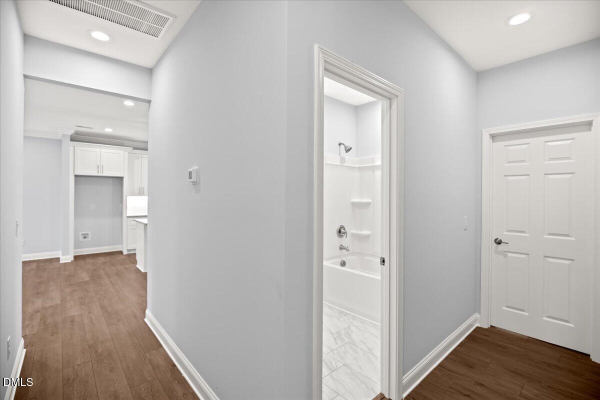 1300 Nick Coley Road Whitakers, NC 27891 - Photo 30 of 47 a view of a hallway with wooden floor