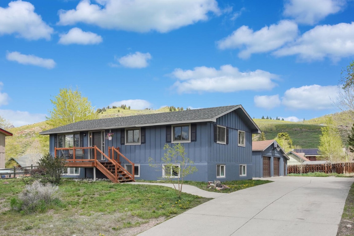 273 Big Elk Road Dillon, CO 80435 - Photo 1 of 38 a front view of a house with garden