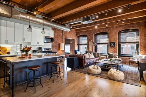 a room with lots of furniture and white appliances