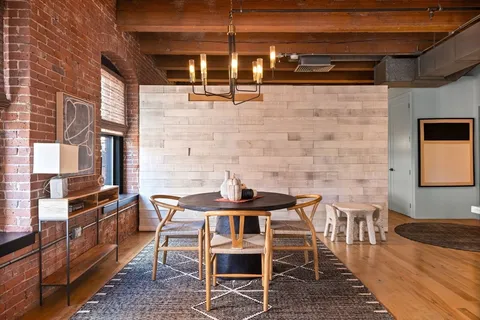 a table and chairs in front of a door