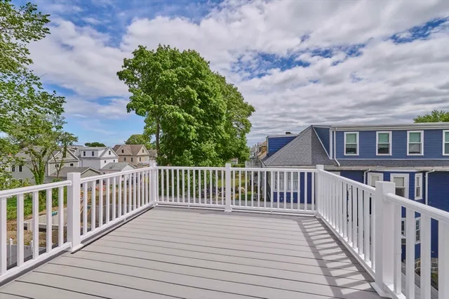 a view of a wooden roof with wooden floor and fence