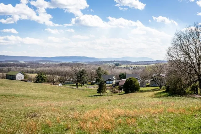 a view of a town with mountains in the background