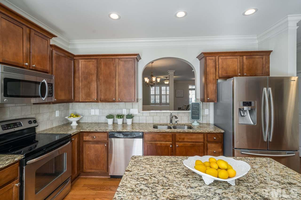 2707 Cloud Mist Circle Raleigh, NC 27614 - Photo 6 of 28 With granite counters, SS appliances and work island.