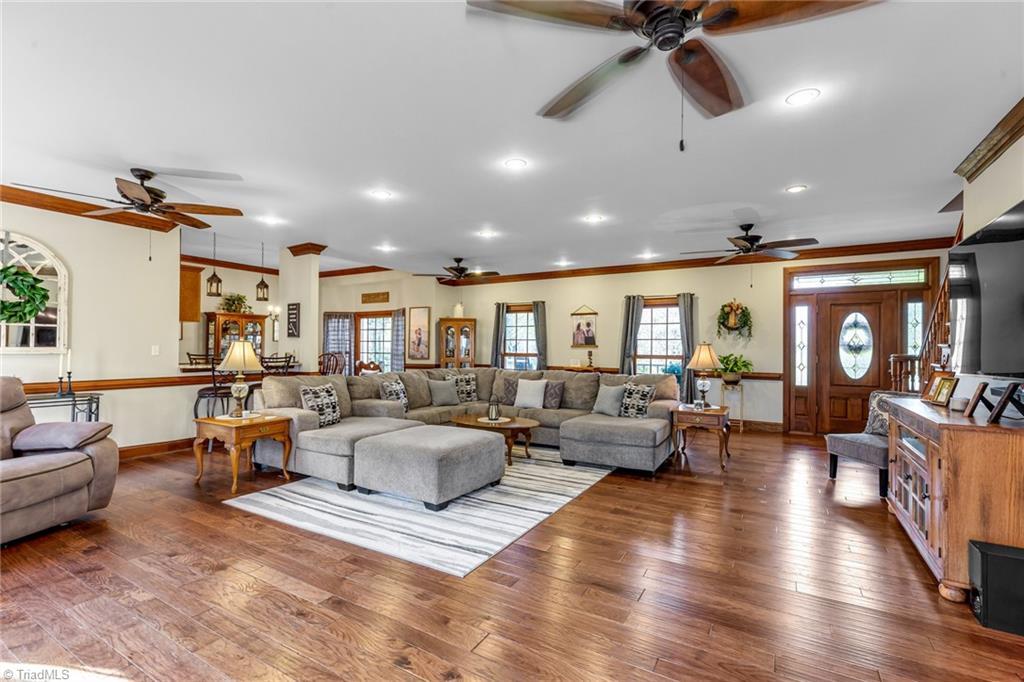1197 Big Oak Road Germanton, NC 27019 - Photo 5 of 49 Open Floor Plan, Wood floors, recessed lighting ceiling fans, crown molding and Fireplace (not shown in photo)