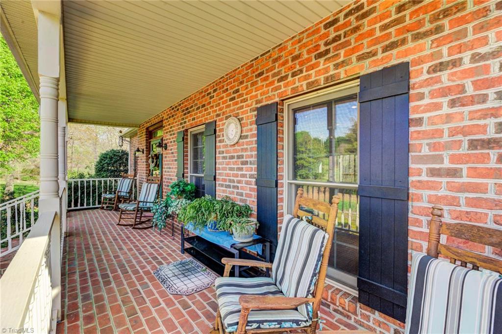 1197 Big Oak Road Germanton, NC 27019 - Photo 8 of 49 Brick paver front porch, Beautiful updated shutters, Tinted windows.
