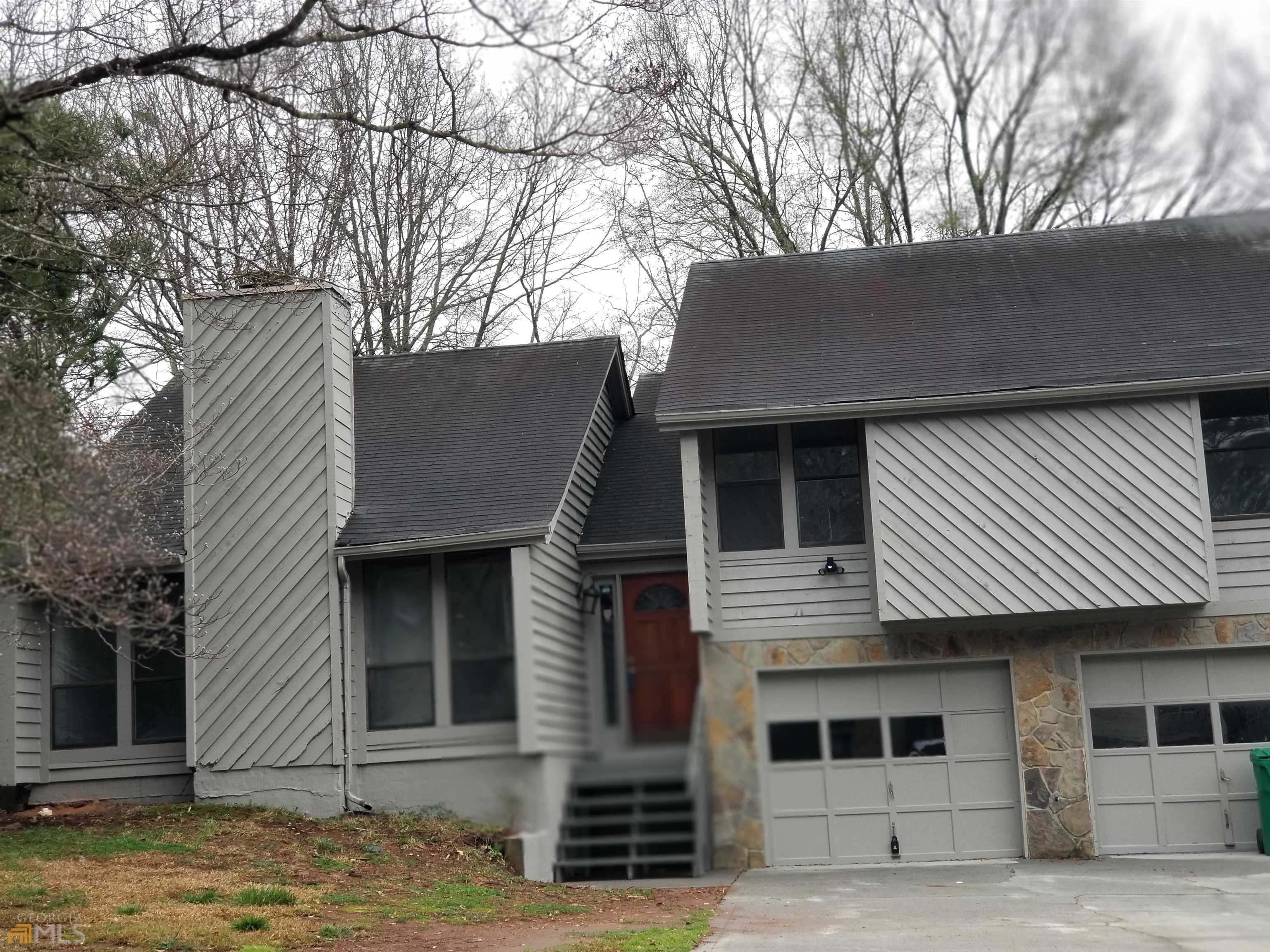 3965 Springleaf Point Stone Mountain, GA 30083 - Photo 1 of 1 a front view of a house with garden