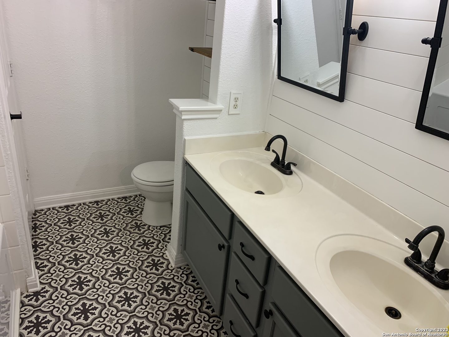 4618 Everett Loop Converse, TX 78109 - Photo 16 of 20 a bathroom with a sink a toilet and mirror
