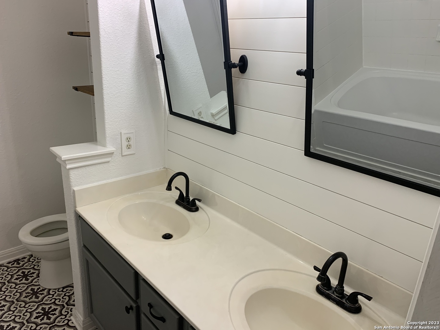 4618 Everett Loop Converse, TX 78109 - Photo 17 of 20 a bathroom with a sink and a mirror