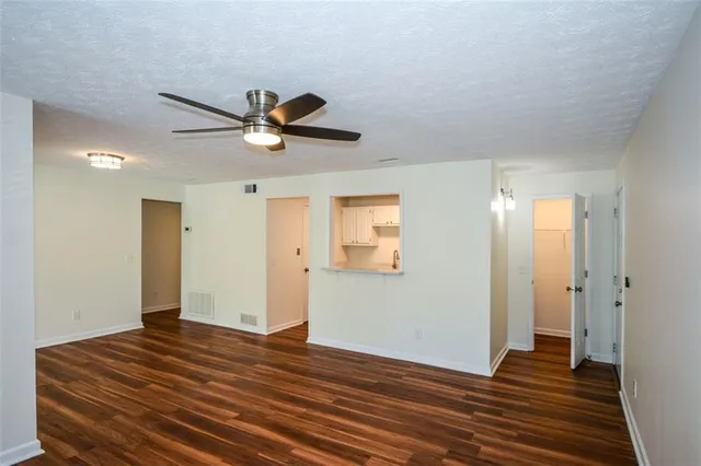 a kitchen with stainless steel appliances a sink a stove a microwave and cabinets