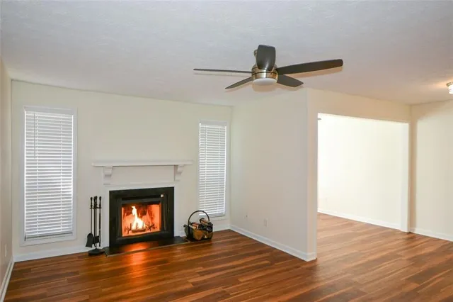 a kitchen that has a sink a stove and cabinets
