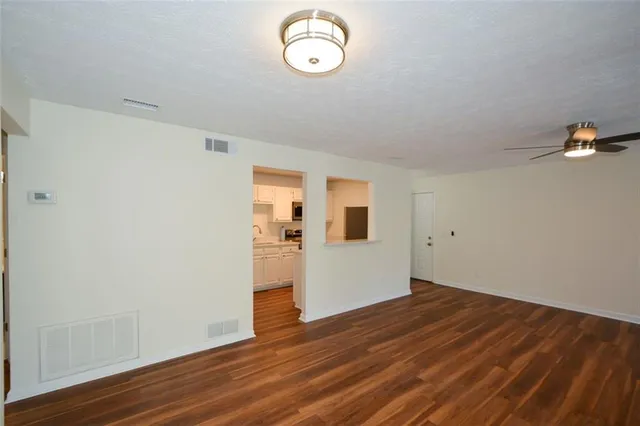 a kitchen with a refrigerator and a sink