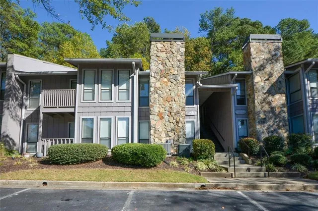 a front view of a house with a street