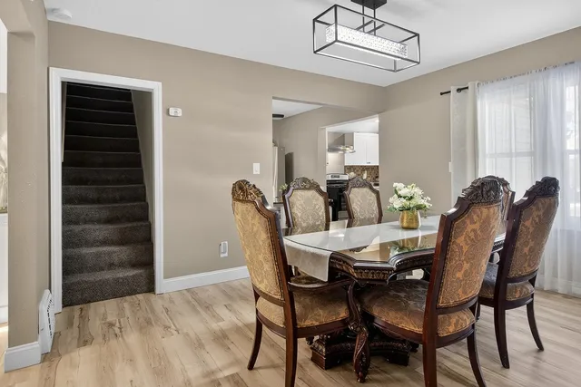 a view of a dining room with furniture and window