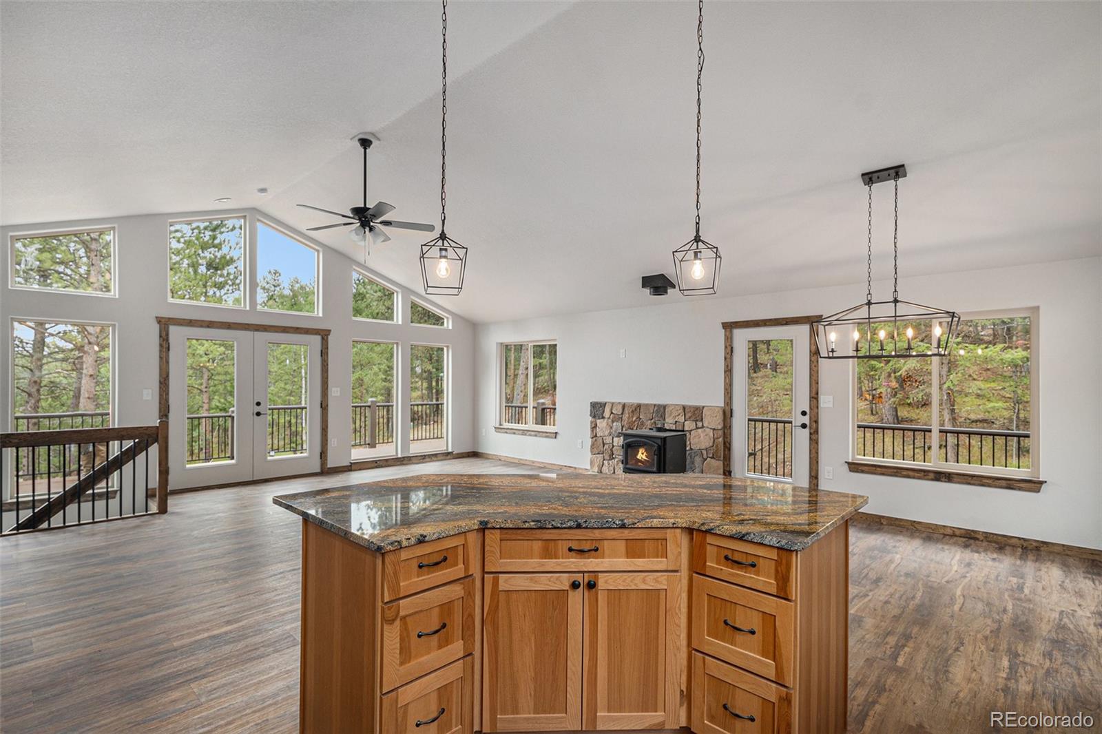 68 Aspen Drive Bailey, CO 80421 - Photo 11 of 35 a kitchen with stainless steel appliances granite countertop a stove and a wooden floors