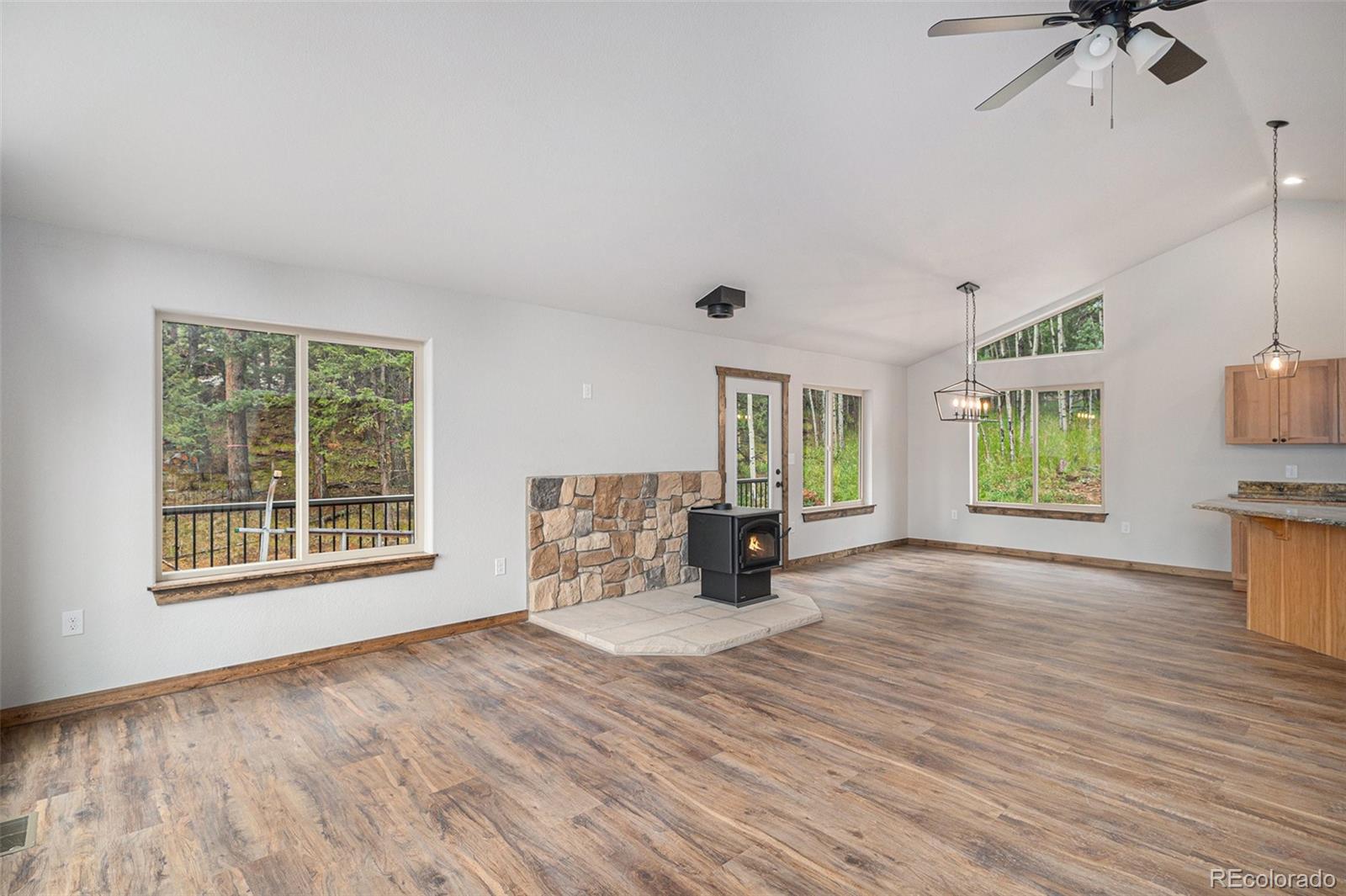 68 Aspen Drive Bailey, CO 80421 - Photo 4 of 35 a view of an empty room with a window and wooden floor