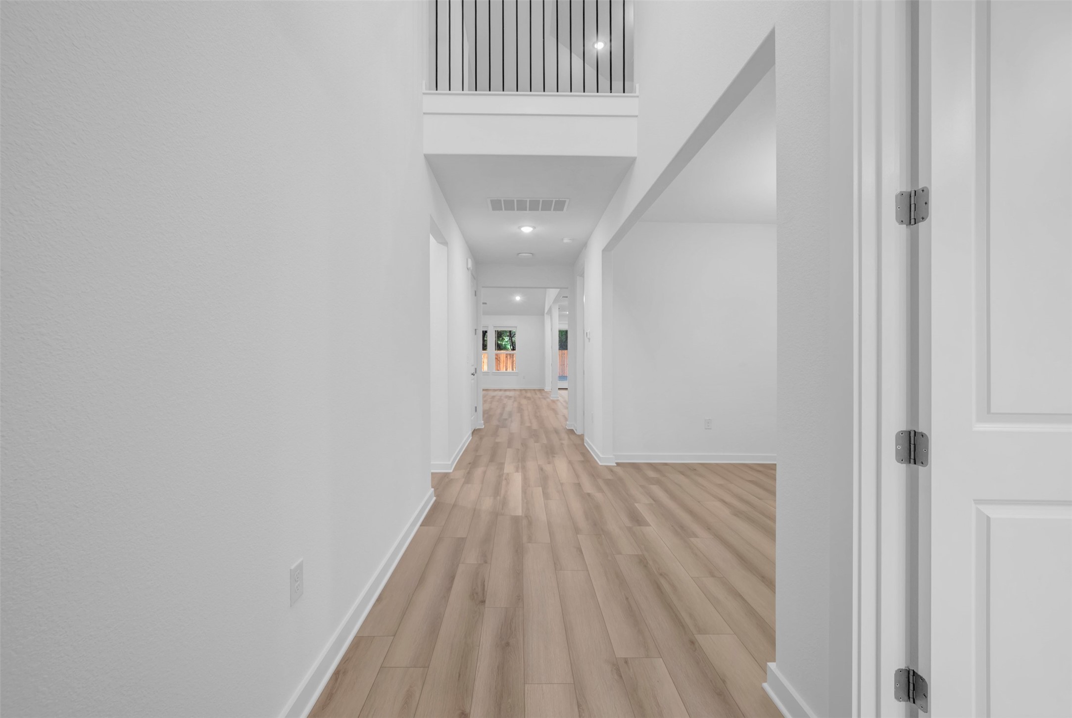 3705 Helena Way Leander, TX 78641 - Photo 11 of 40 a view of a hallway with wooden floor