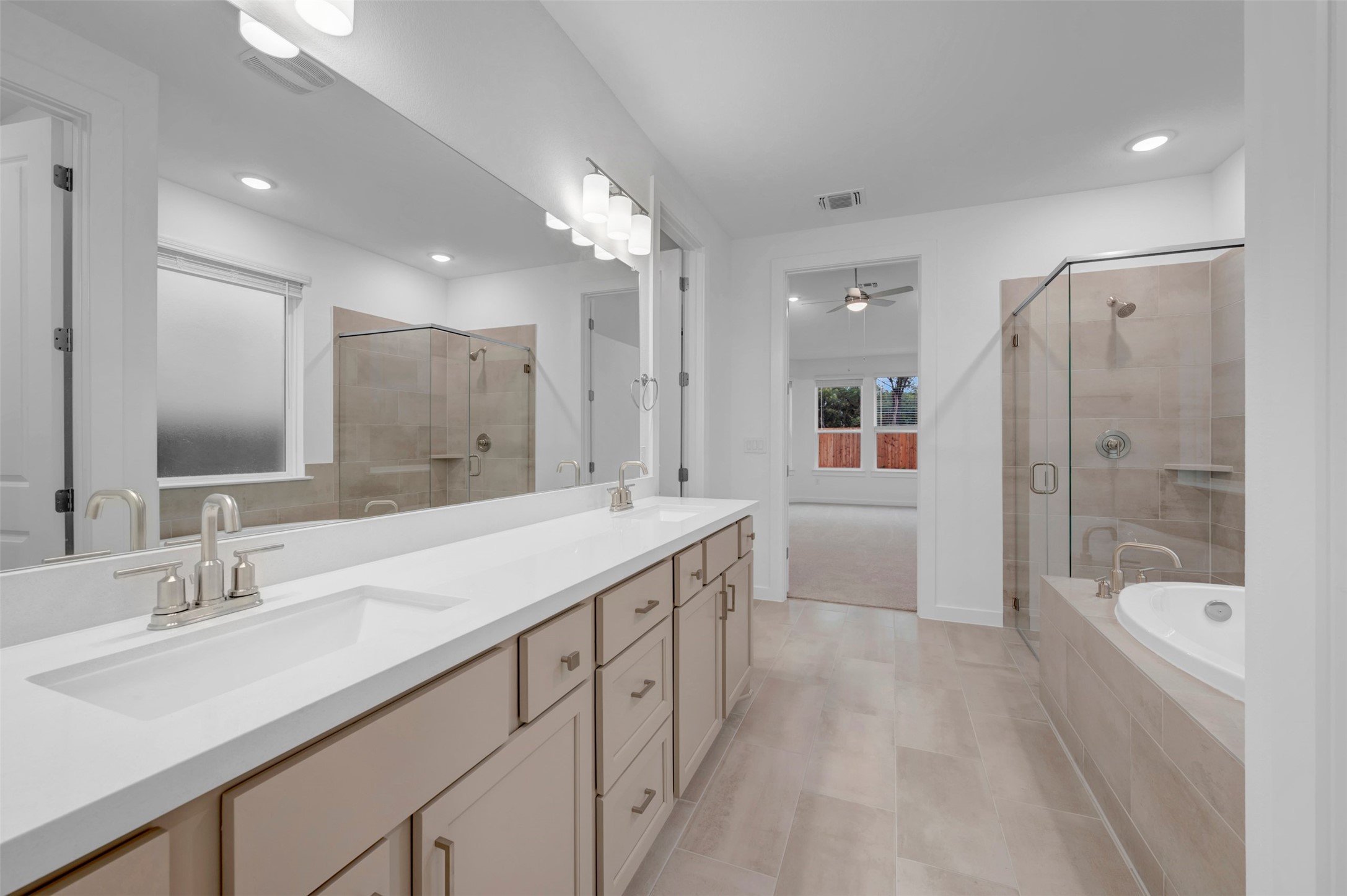 3705 Helena Way Leander, TX 78641 - Photo 22 of 40 a bathroom with a sink a toilet a shower a tub and a mirror