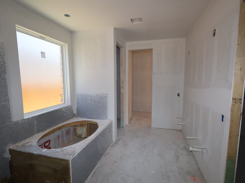 3705 Helena Way Leander, TX 78641 - Photo 3 of 7 a bathroom with a sink a window and tub