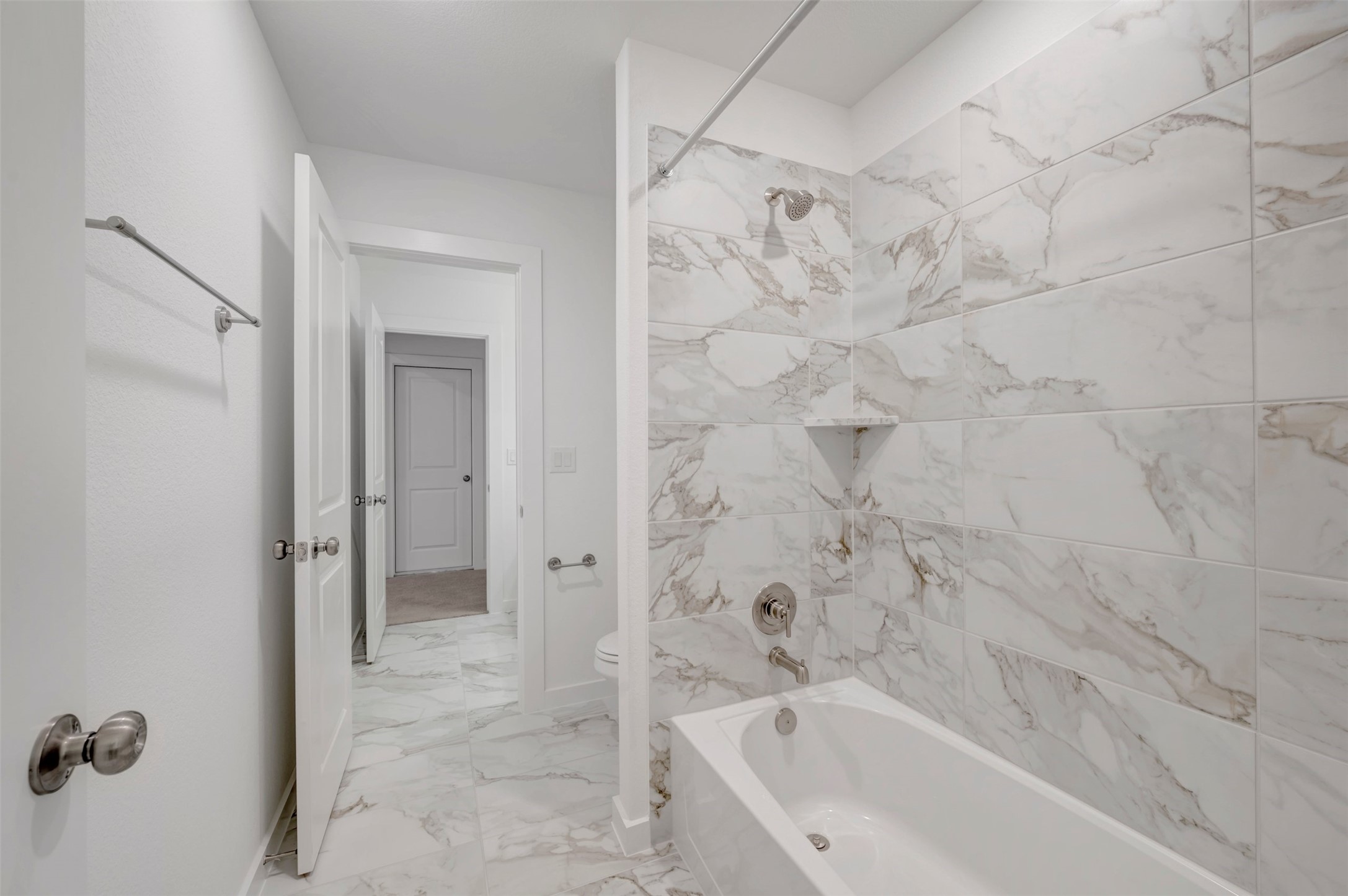 3705 Helena Way Leander, TX 78641 - Photo 31 of 40 a bathroom with a bathtub and shower