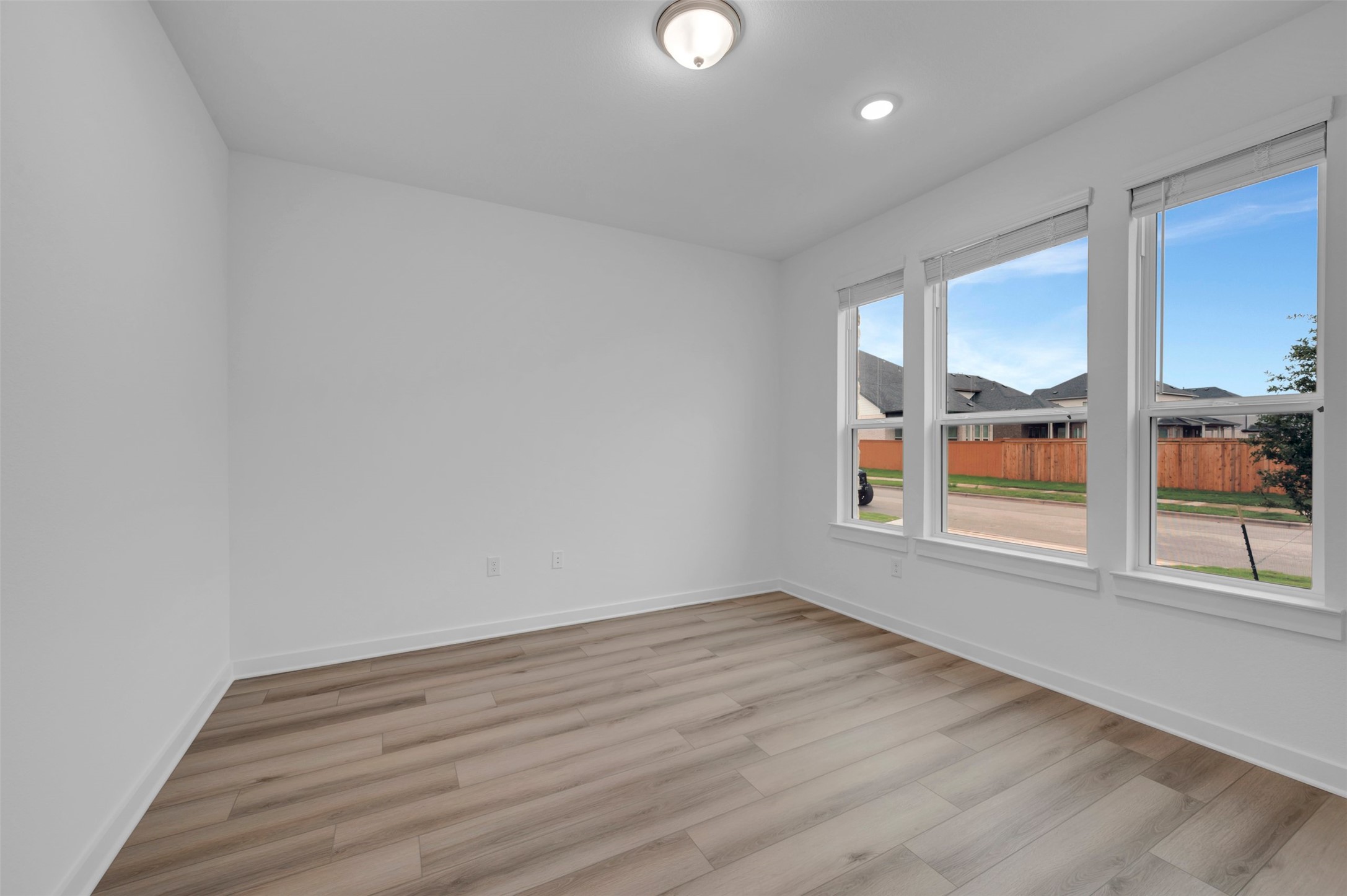 3705 Helena Way Leander, TX 78641 - Photo 4 of 40 wooden floor in an empty room with a window