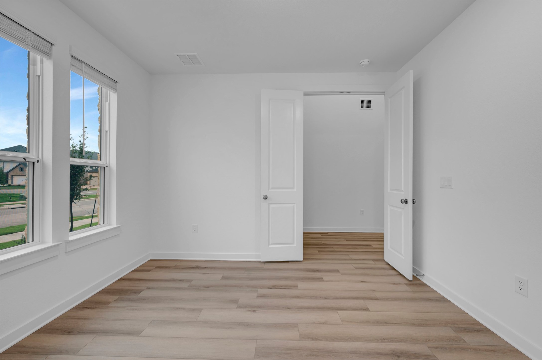 3705 Helena Way Leander, TX 78641 - Photo 5 of 40 a view of an empty room with wooden floor and window
