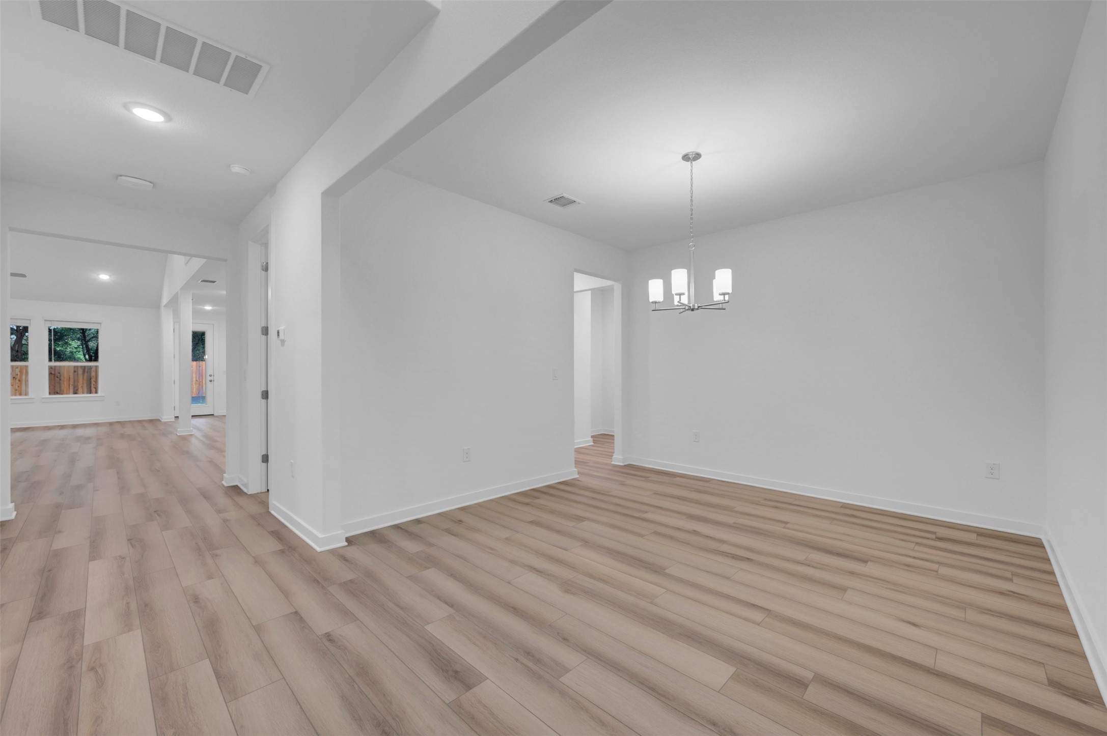 3705 Helena Way Leander, TX 78641 - Photo 6 of 40 a view of an empty room and wooden floor