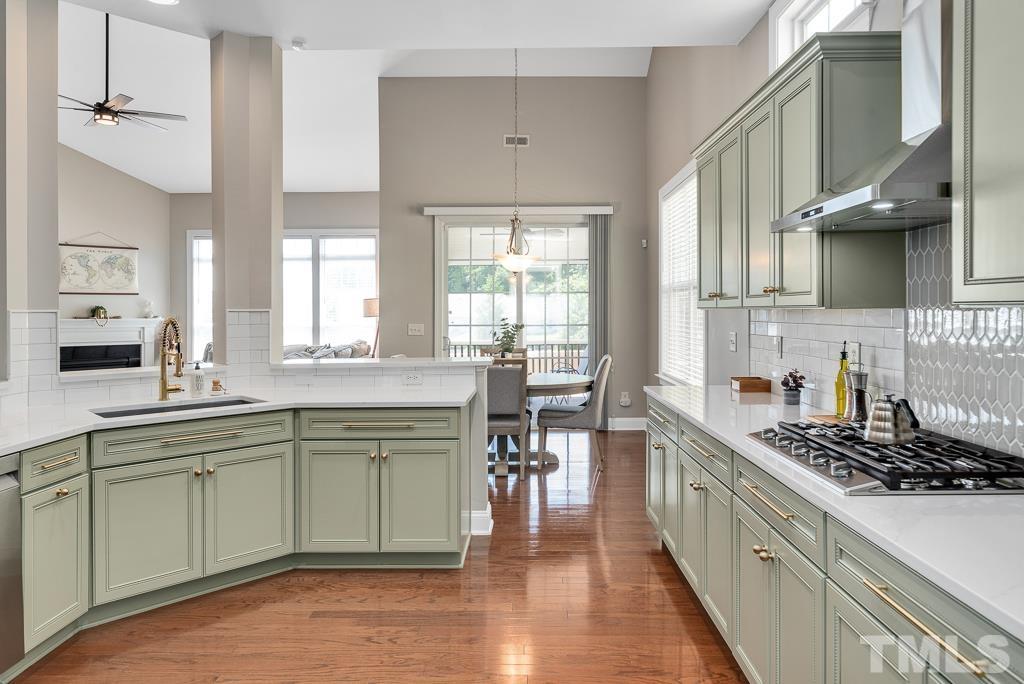 1136 Chapanoke Road Raleigh, NC 27603 - Photo 11 of 48 a kitchen with a sink stove and cabinets