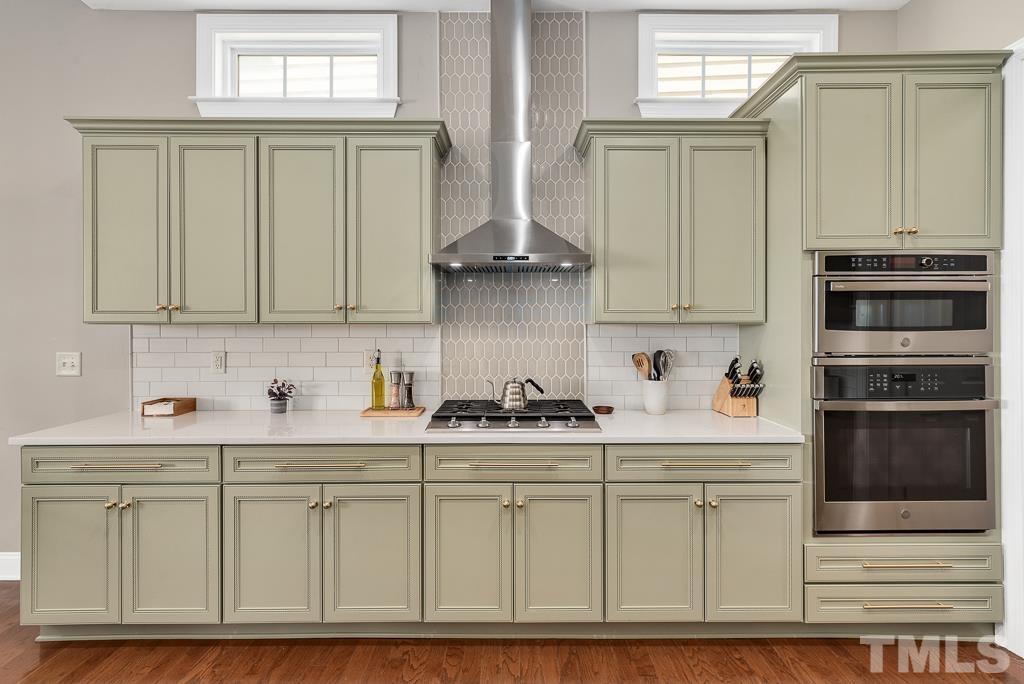 1136 Chapanoke Road Raleigh, NC 27603 - Photo 12 of 48 a kitchen with stainless steel appliances granite countertop a stove and cabinets