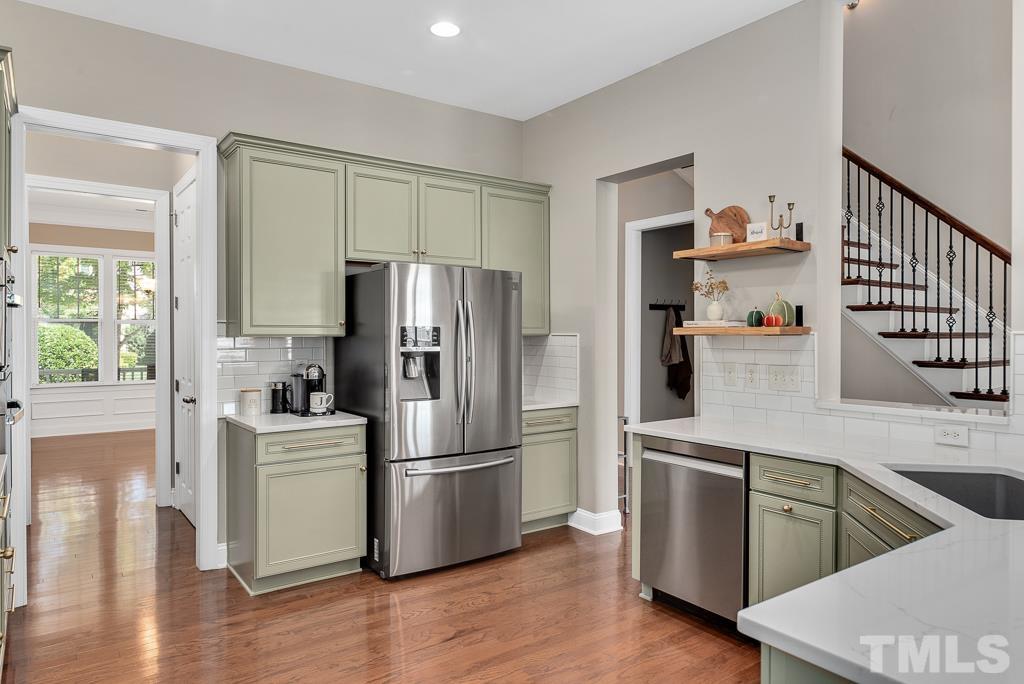 1136 Chapanoke Road Raleigh, NC 27603 - Photo 13 of 48 a kitchen with a refrigerator and a sink