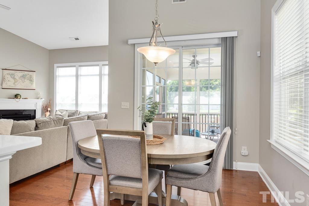 1136 Chapanoke Road Raleigh, NC 27603 - Photo 16 of 48 a view of a dining room with furniture window and wooden floor