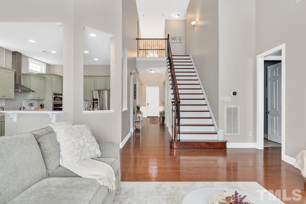 1136 Chapanoke Road Raleigh, NC 27603 - Photo 17 of 48 a living room with furniture and a wooden floor