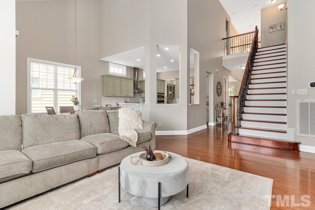 1136 Chapanoke Road Raleigh, NC 27603 - Photo 18 of 48 a living room with furniture and a wooden floor