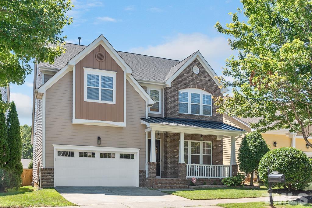 1136 Chapanoke Road Raleigh, NC 27603 - Photo 2 of 48 a front view of a house with a yard