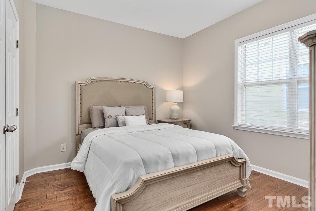 1136 Chapanoke Road Raleigh, NC 27603 - Photo 25 of 48 a bedroom with a bed and a window