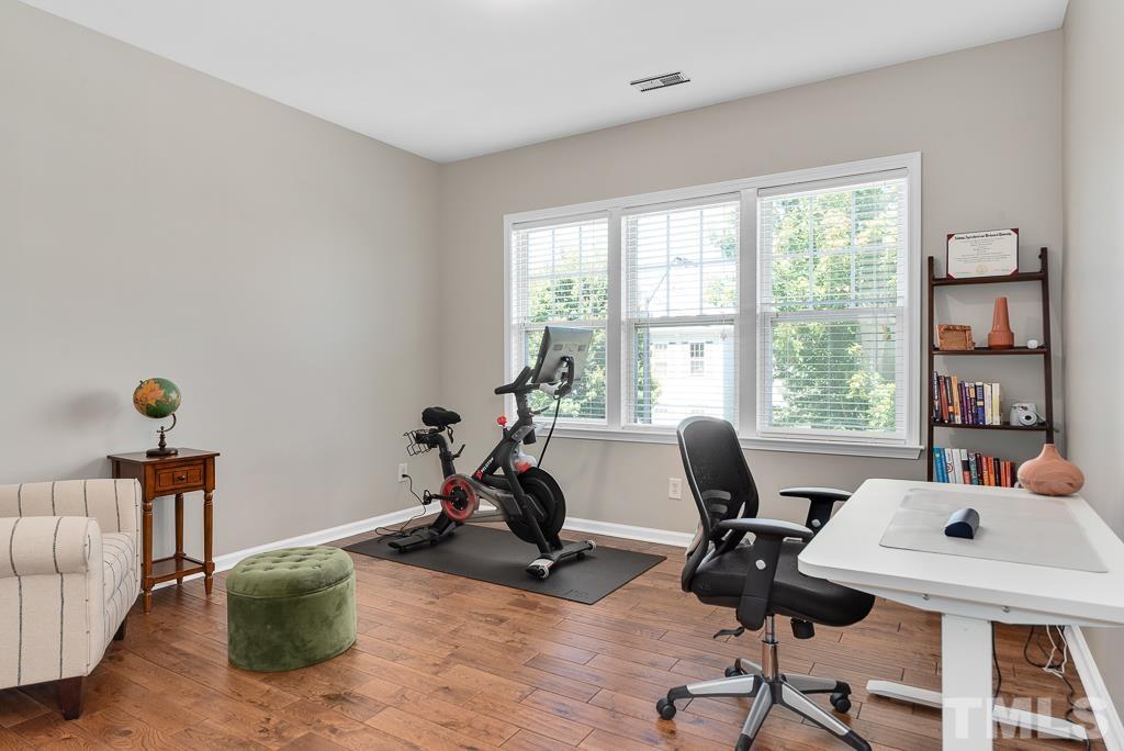 1136 Chapanoke Road Raleigh, NC 27603 - Photo 28 of 48 a view of a workspace with furniture and a window
