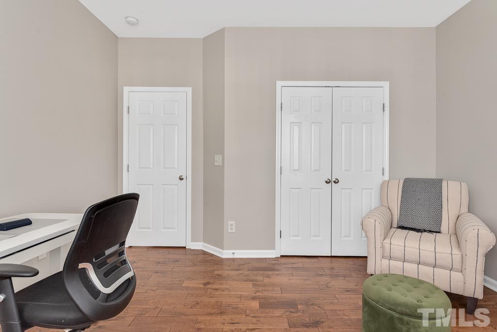 1136 Chapanoke Road Raleigh, NC 27603 - Photo 29 of 48 a view of workspace and bedroom with furniture