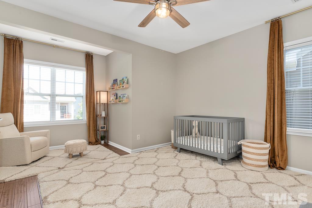 1136 Chapanoke Road Raleigh, NC 27603 - Photo 30 of 48 a bedroom with furniture and window
