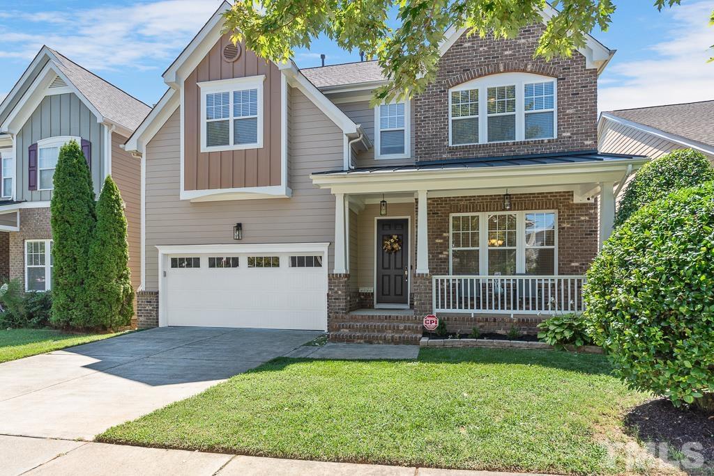 1136 Chapanoke Road Raleigh, NC 27603 - Photo 3 of 48 a front view of a house with a garden