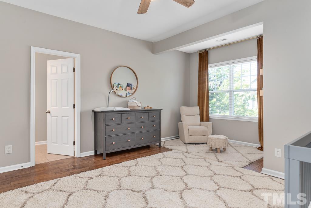 1136 Chapanoke Road Raleigh, NC 27603 - Photo 31 of 48 a bedroom with a bed and a window