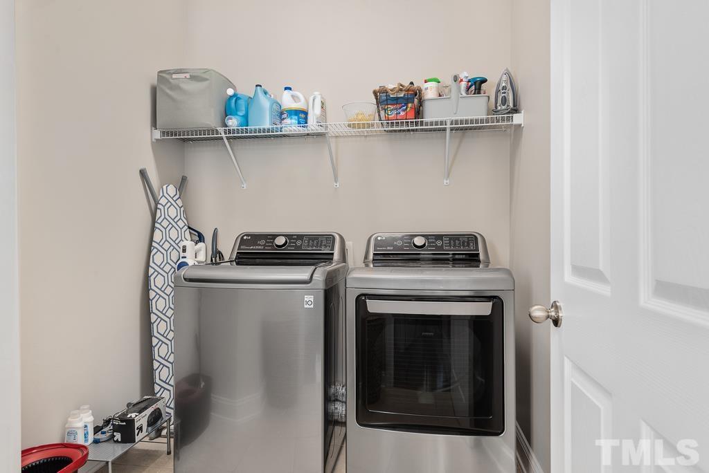 1136 Chapanoke Road Raleigh, NC 27603 - Photo 34 of 48 a kitchen with a stove and cabinets
