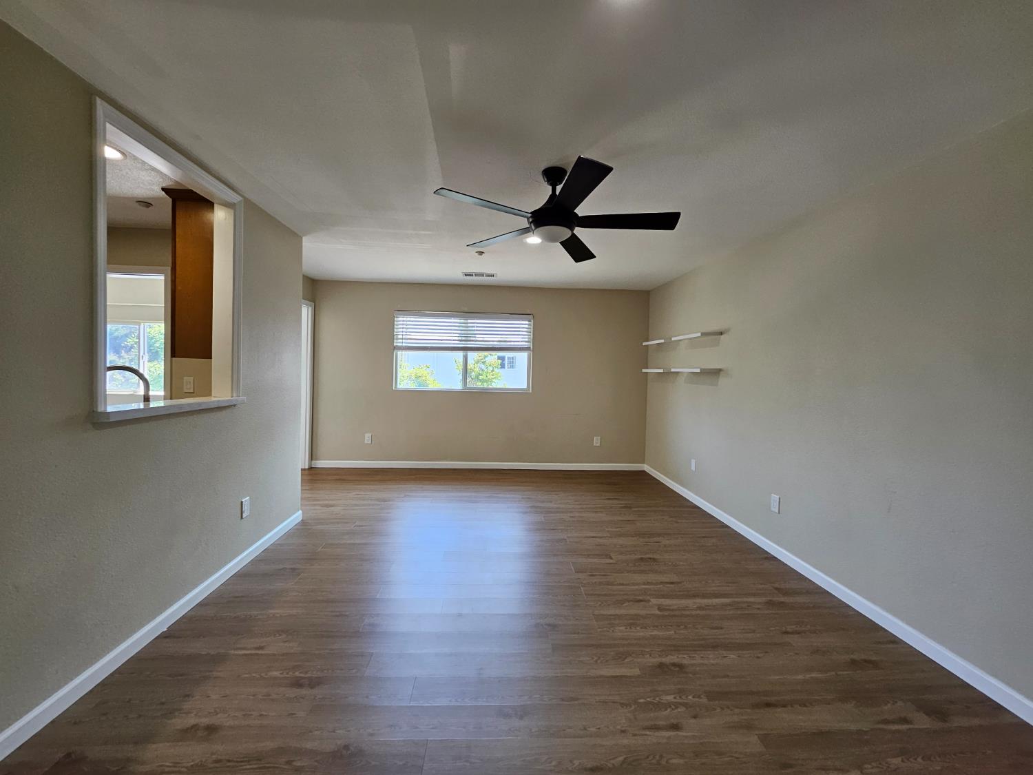 25231 Whitman Street, Unit 103 Hayward, CA 94544 - Photo 11 of 30 a view of empty room with wooden floor and fan