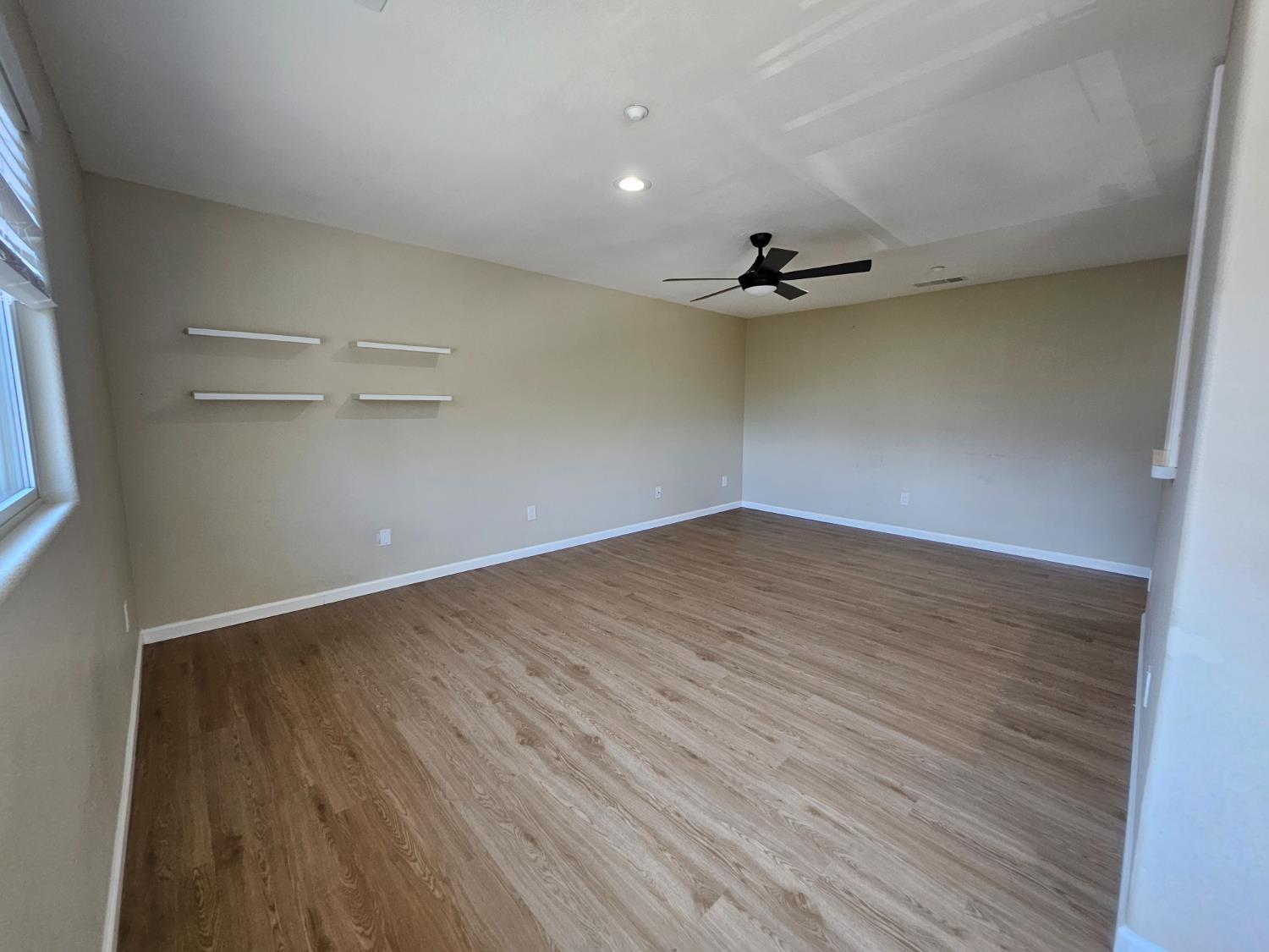 25231 Whitman Street, Unit 103 Hayward, CA 94544 - Photo 13 of 30 wooden floor in an empty room with a window