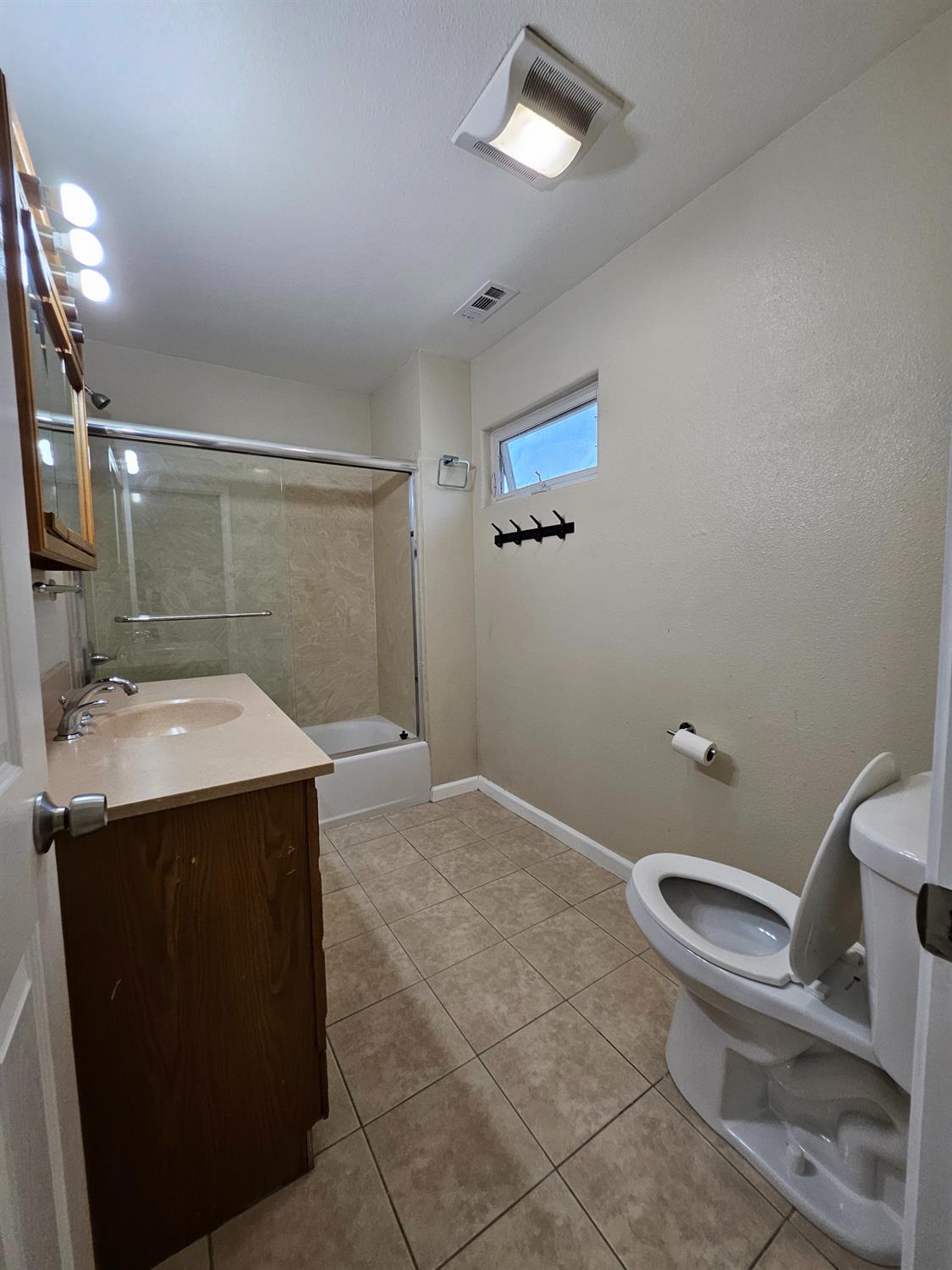 25231 Whitman Street, Unit 103 Hayward, CA 94544 - Photo 24 of 30 a bathroom with a sink mirror vanity and toilet