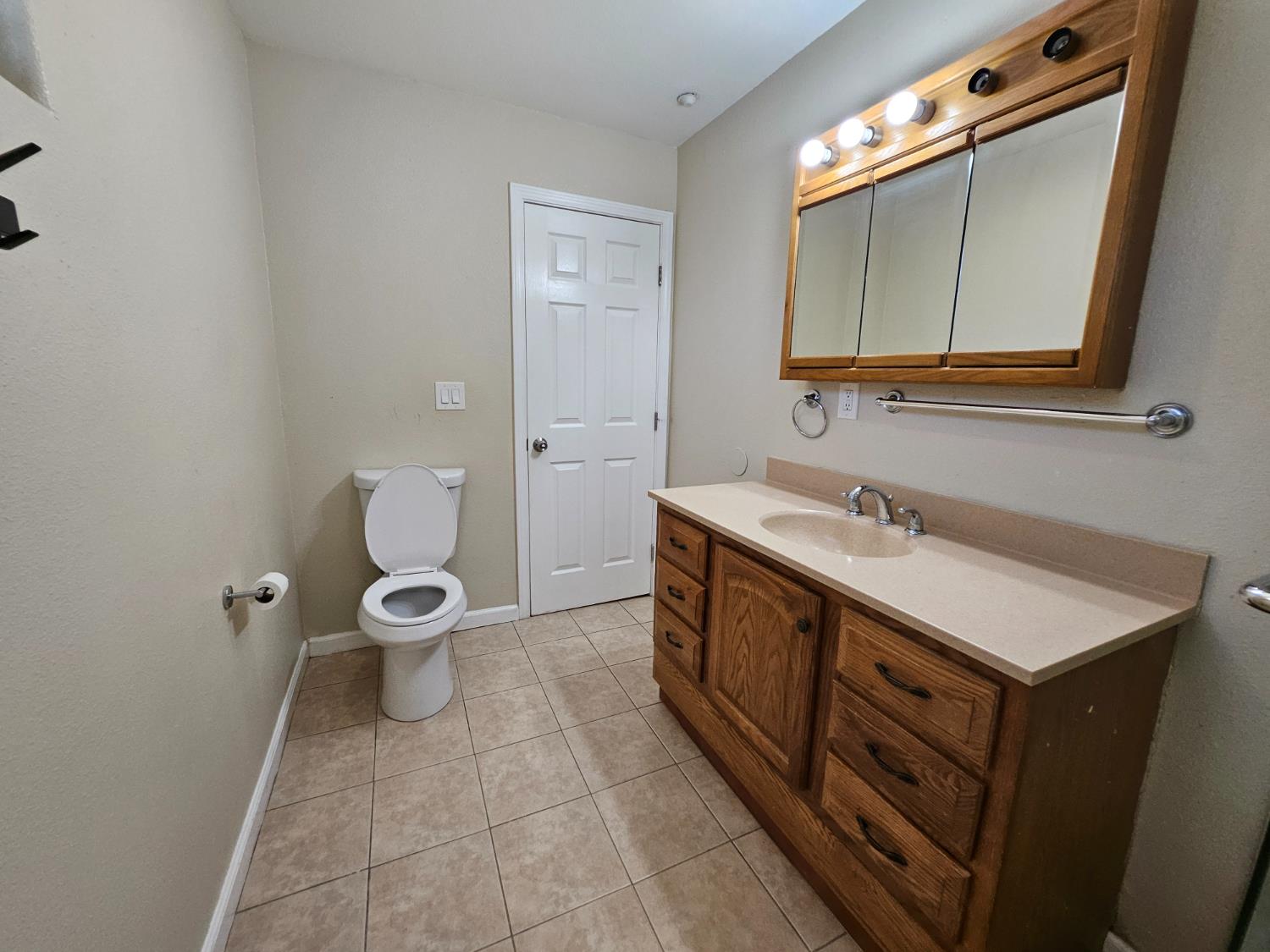25231 Whitman Street, Unit 103 Hayward, CA 94544 - Photo 27 of 30 a bathroom with a sink mirror vanity and toilet