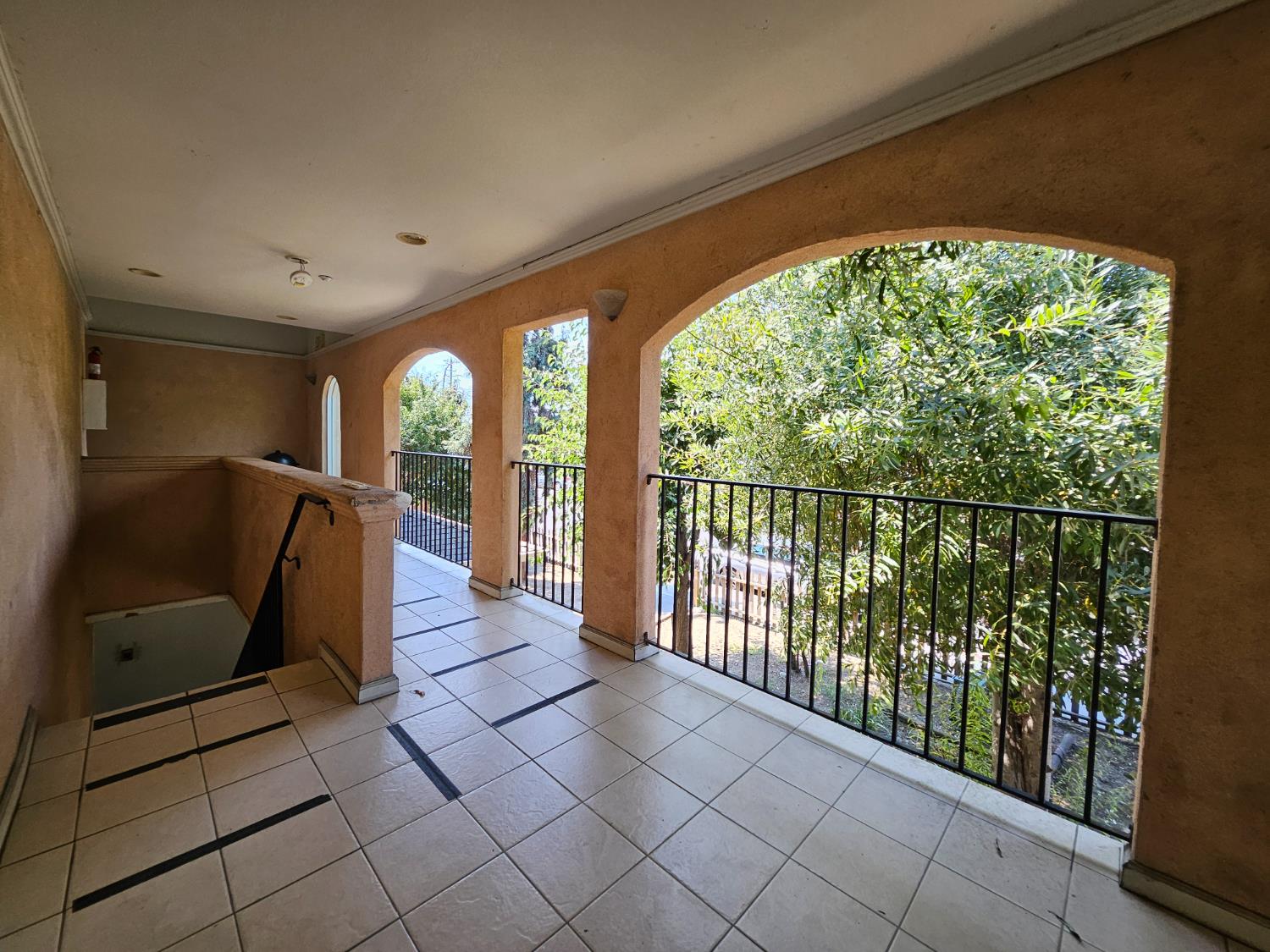 25231 Whitman Street, Unit 103 Hayward, CA 94544 - Photo 3 of 30 a view of a hallway with wooden floor and windows